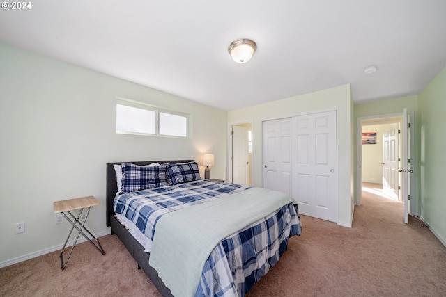 carpeted bedroom featuring a closet