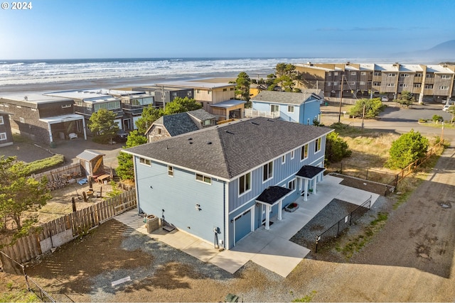 bird's eye view featuring a water view and a view of the beach