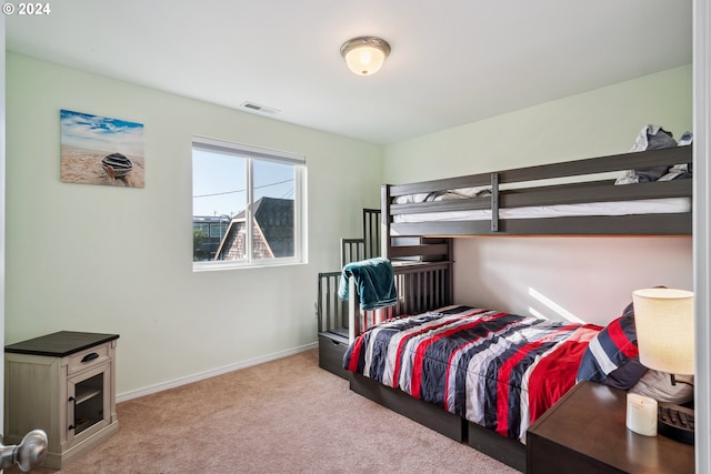 bedroom with light colored carpet