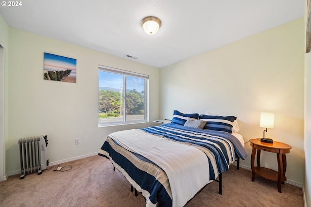 bedroom featuring carpet flooring and radiator