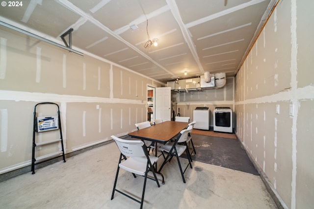 dining room with washer and dryer and concrete floors