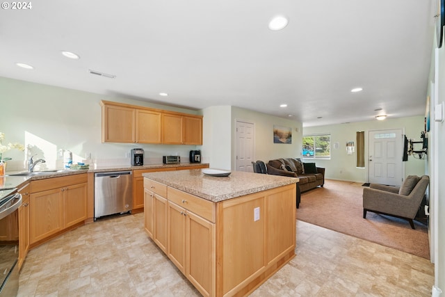 kitchen with dishwasher, a center island, light brown cabinets, light carpet, and sink