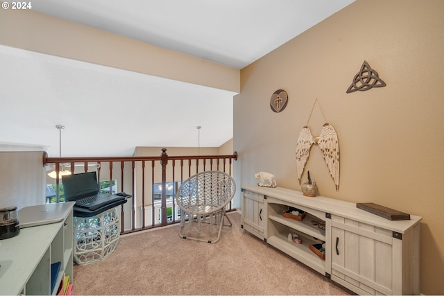 interior space featuring vaulted ceiling and light carpet