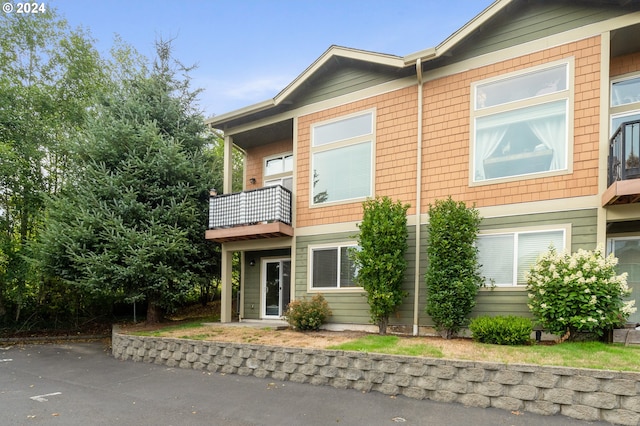 view of front of home with a balcony