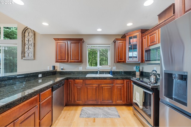 kitchen featuring sink, stainless steel appliances, and light wood-type flooring