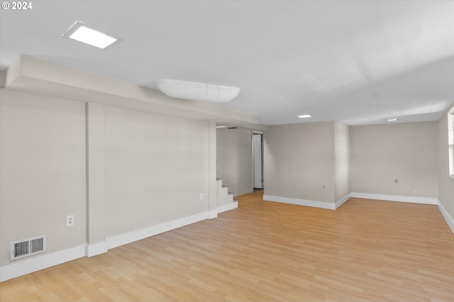 basement featuring light hardwood / wood-style flooring