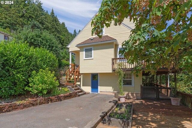 view of front of house featuring a wooden deck