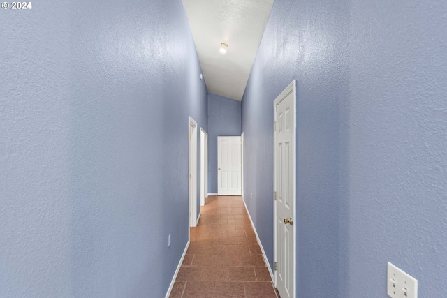 hall with lofted ceiling