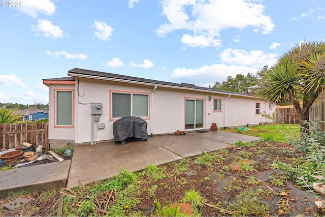 rear view of house with a patio