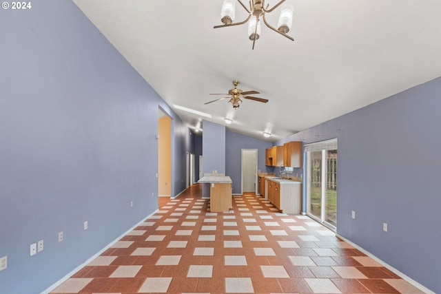 interior space featuring ceiling fan and sink