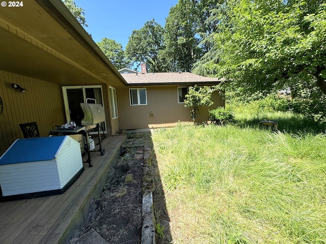 view of yard with a deck