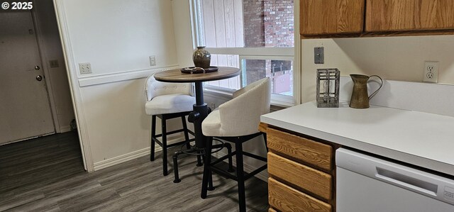 bathroom with toilet, vanity, hardwood / wood-style flooring, and a bathing tub