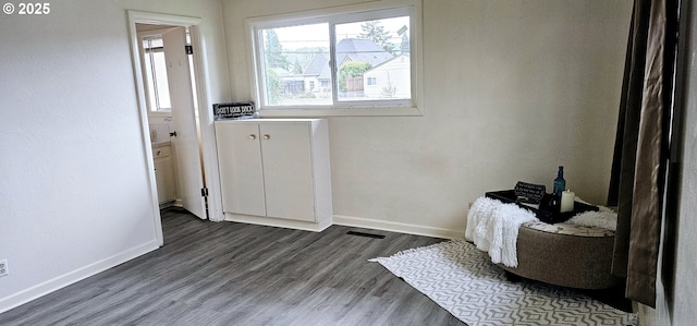 entryway with dark wood-style flooring and baseboards