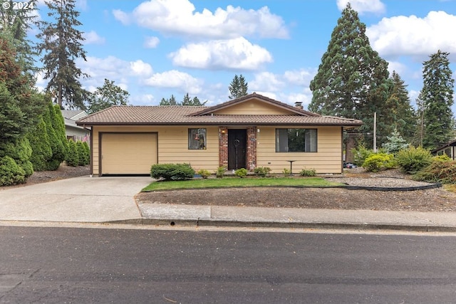 ranch-style house featuring a garage