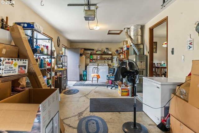 garage featuring fridge, a garage door opener, washing machine and clothes dryer, and secured water heater