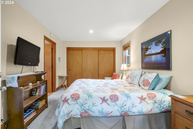 carpeted bedroom featuring a closet