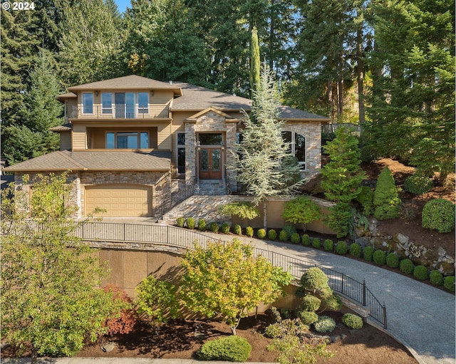 prairie-style home featuring a garage