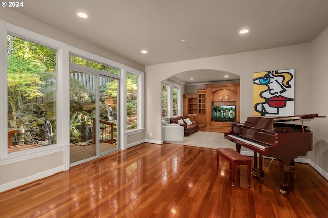 sitting room with wood-type flooring