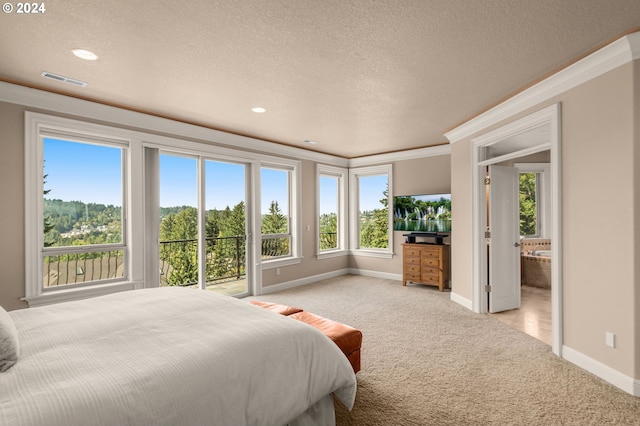 carpeted bedroom featuring connected bathroom, crown molding, and a textured ceiling