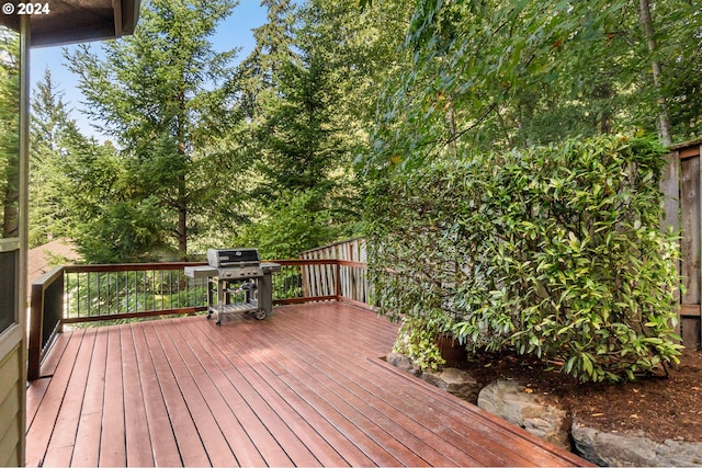 wooden deck featuring area for grilling