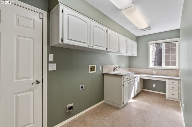 washroom with hookup for a washing machine, electric dryer hookup, sink, light tile patterned flooring, and cabinets