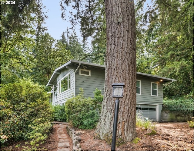 view of property exterior featuring a garage