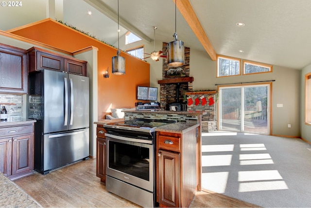 kitchen featuring pendant lighting, ceiling fan, light wood-type flooring, appliances with stainless steel finishes, and beamed ceiling