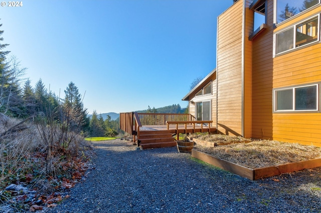 view of yard featuring a wooden deck