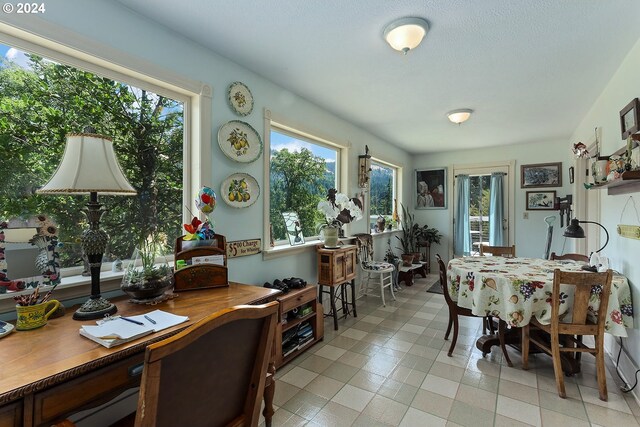 dining space with light tile patterned floors