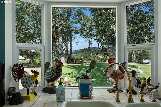 sunroom featuring sink and plenty of natural light