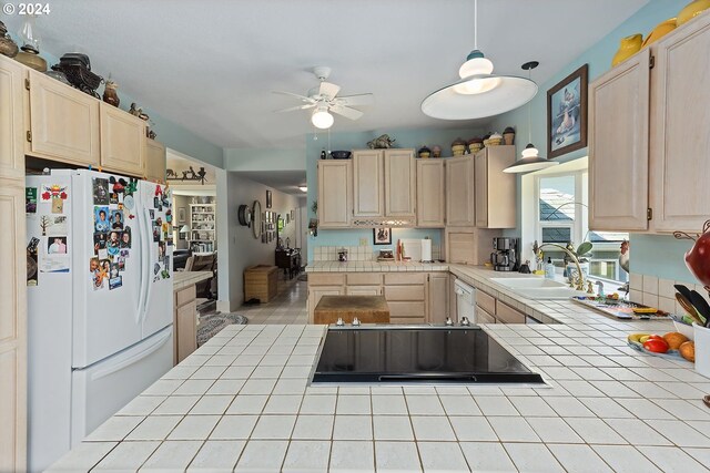 kitchen featuring light brown cabinets, ceiling fan, tile counters, white appliances, and sink