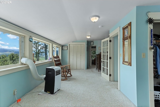 living area with vaulted ceiling