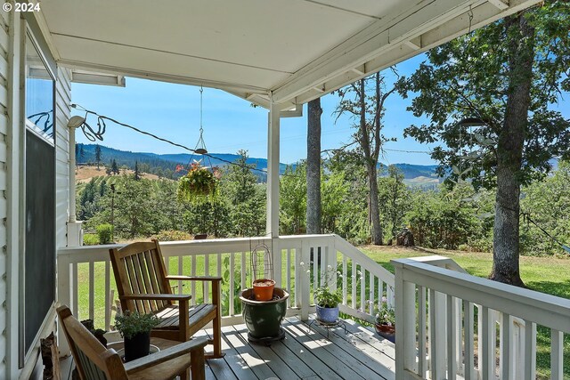 wooden terrace with a mountain view