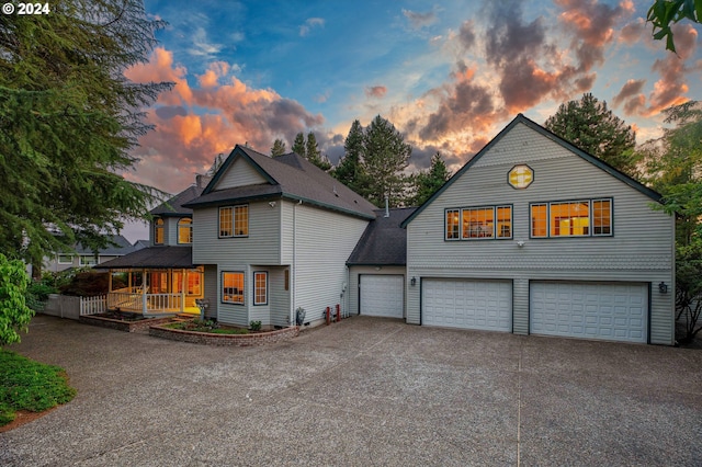 view of front of home with a porch and a garage