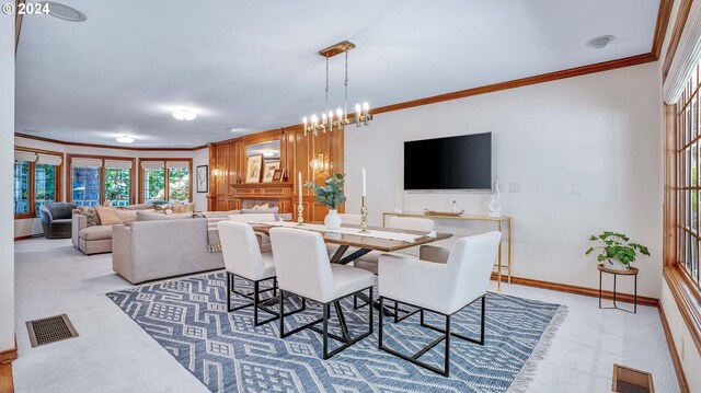 carpeted dining room featuring an inviting chandelier and crown molding