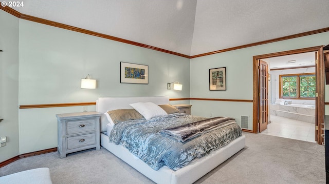 carpeted bedroom with ensuite bathroom, a textured ceiling, ornamental molding, and vaulted ceiling