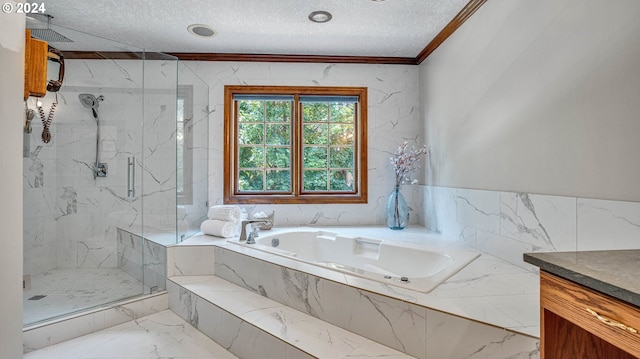 bathroom featuring a textured ceiling, ornamental molding, independent shower and bath, and vanity