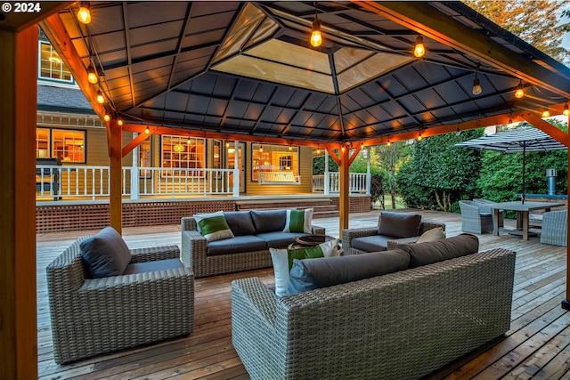 wooden deck with a gazebo and an outdoor living space