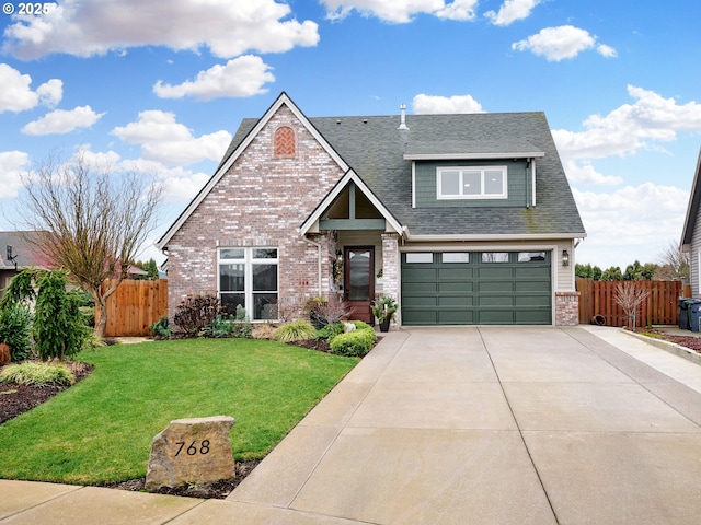 view of front of home with a front yard and a garage