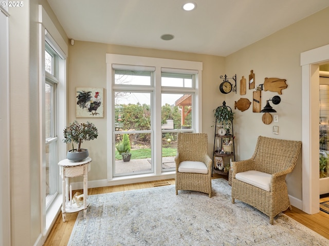 sitting room with hardwood / wood-style floors