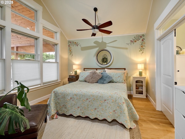 bedroom featuring lofted ceiling, ceiling fan, and light hardwood / wood-style floors