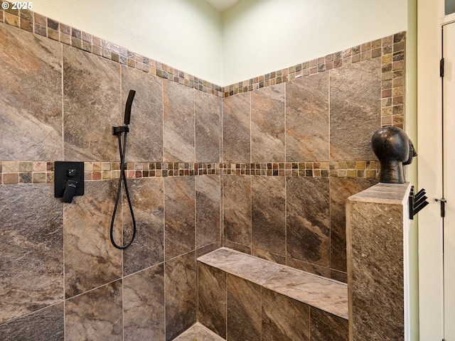 bathroom featuring tiled shower