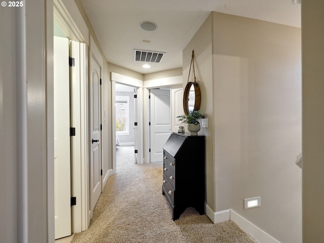 hallway with light carpet