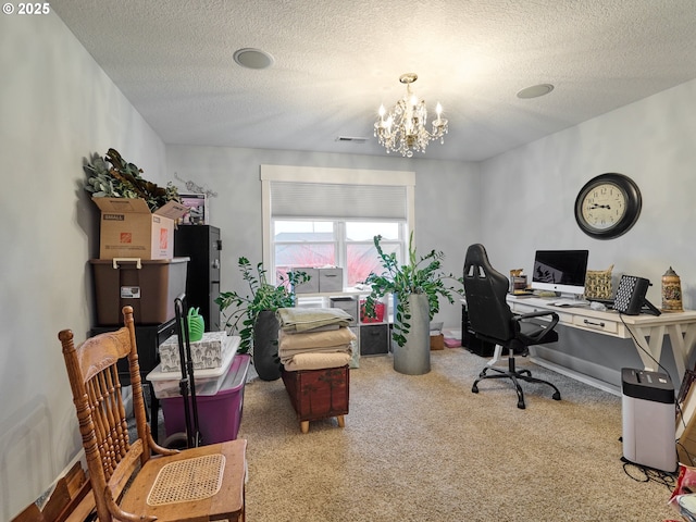 home office featuring an inviting chandelier and a textured ceiling