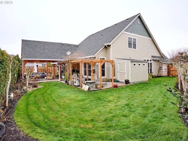 rear view of house with a patio area and a yard