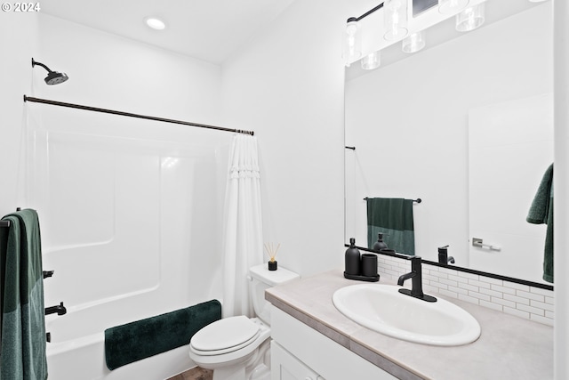 full bathroom with vanity, toilet, shower / bath combo with shower curtain, and backsplash