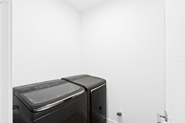 washroom with washer and dryer