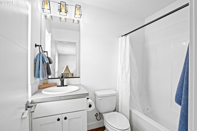 full bathroom with vanity, toilet, and shower / bath combination with curtain