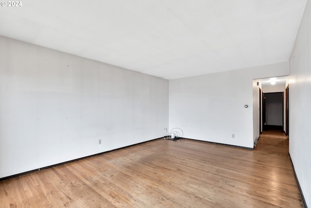 empty room with light hardwood / wood-style floors