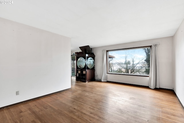 unfurnished room featuring light hardwood / wood-style floors